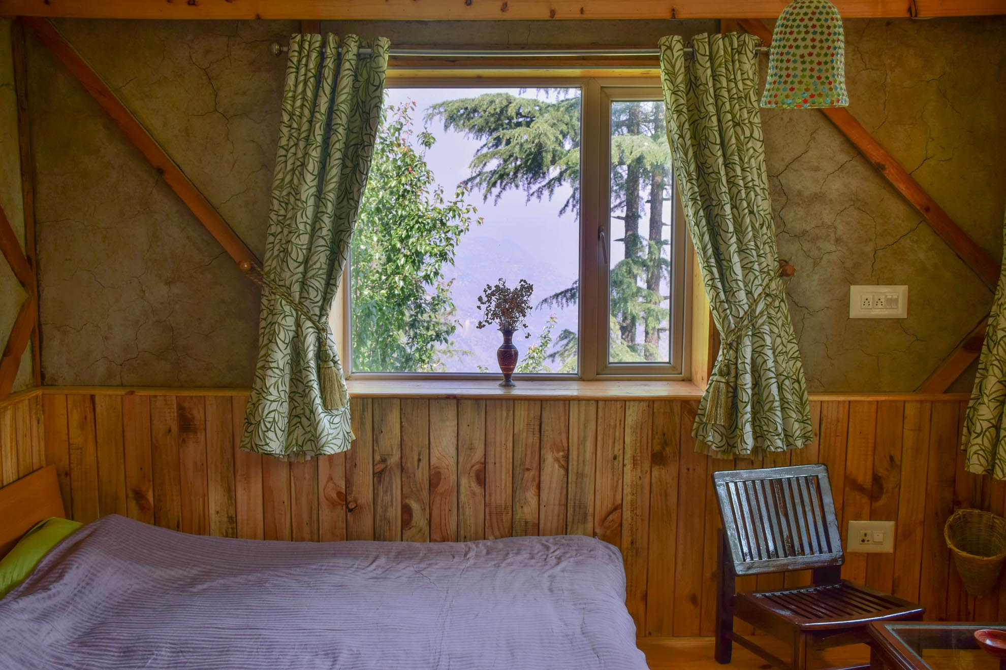 The Sunset Valley room — stone, wood, and mountain light